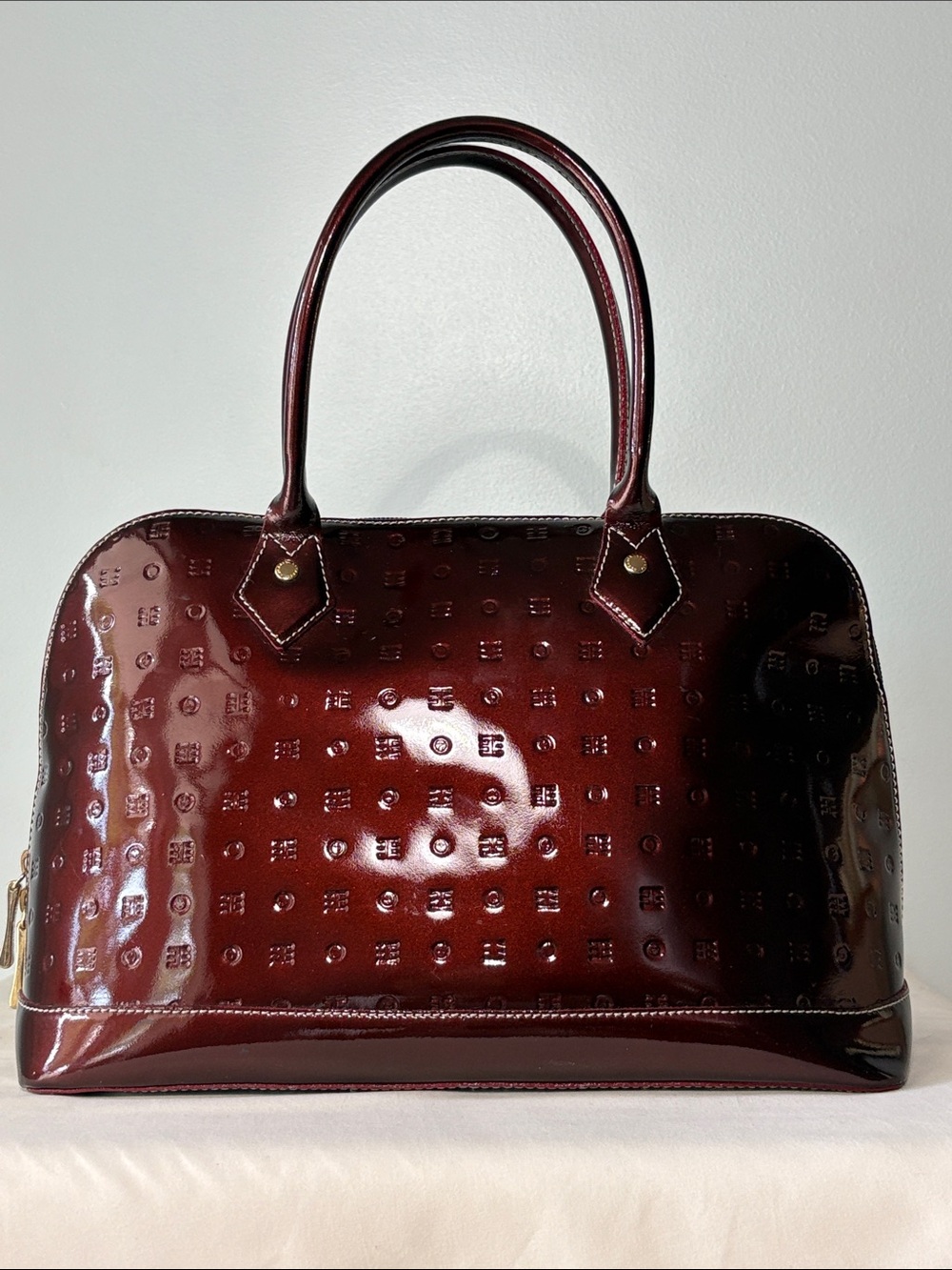 Arcadia Italian Embossed Patent Leather Monogram Dome Satchel Bag. Burgundy